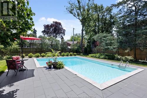7505 Riverside Drive East, Windsor, ON - Outdoor With In Ground Pool With Deck Patio Veranda With Backyard