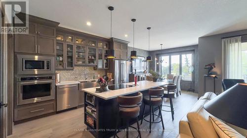 68 Deerfield Road, Lambton Shores (Grand Bend), ON - Indoor Photo Showing Kitchen With Stainless Steel Kitchen With Double Sink With Upgraded Kitchen