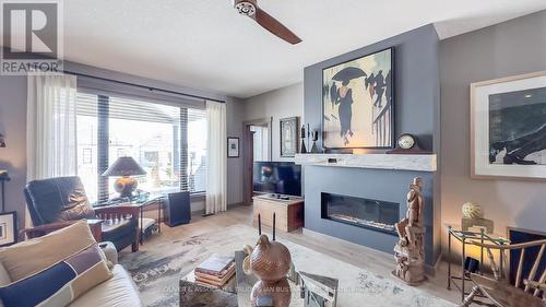 68 Deerfield Road, Lambton Shores (Grand Bend), ON - Indoor Photo Showing Living Room With Fireplace