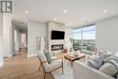 1001 - 460 Callaway Road, London, ON - Indoor Photo Showing Living Room With Fireplace