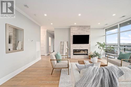 1001 - 460 Callaway Road, London, ON - Indoor Photo Showing Living Room With Fireplace