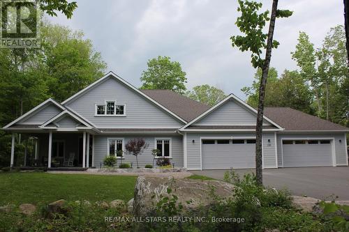 228 Riverside Drive, Kawartha Lakes, ON - Outdoor With Facade