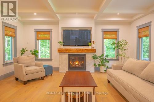 228 Riverside Drive, Kawartha Lakes, ON - Indoor Photo Showing Living Room With Fireplace
