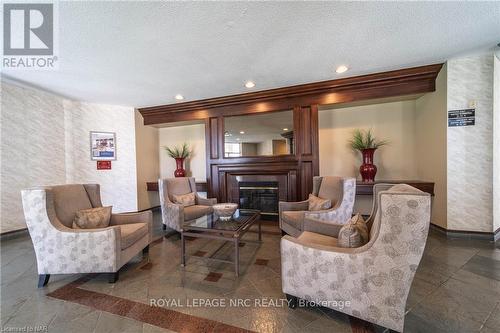 107 - 8111 Forest Glen Drive, Niagara Falls, ON - Indoor Photo Showing Living Room With Fireplace