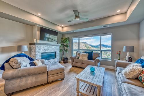 14-2161 Upper Sundance Drive, West Kelowna, BC - Indoor Photo Showing Living Room With Fireplace