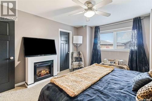5 502 Rempel Manor, Saskatoon, SK - Indoor Photo Showing Bedroom With Fireplace