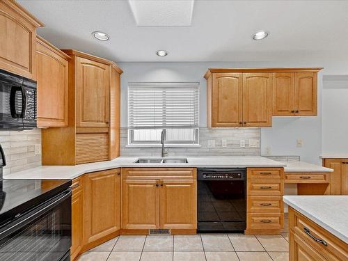 97-2365 Stillingfleet Road, Kelowna, BC - Indoor Photo Showing Kitchen With Double Sink