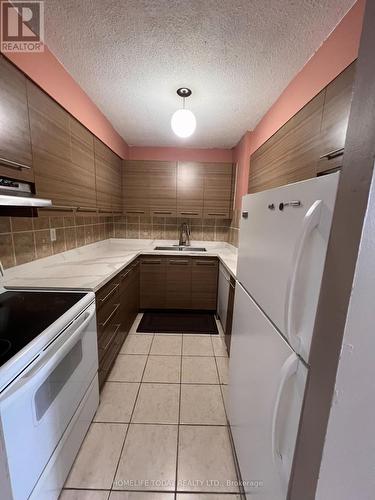 706 - 10 Tapscott Road, Toronto, ON - Indoor Photo Showing Kitchen With Double Sink