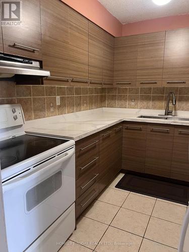 706 - 10 Tapscott Road, Toronto, ON - Indoor Photo Showing Kitchen With Double Sink