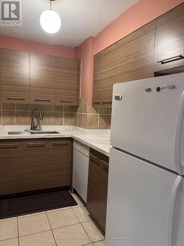 706 - 10 Tapscott Road, Toronto, ON - Indoor Photo Showing Kitchen With Double Sink