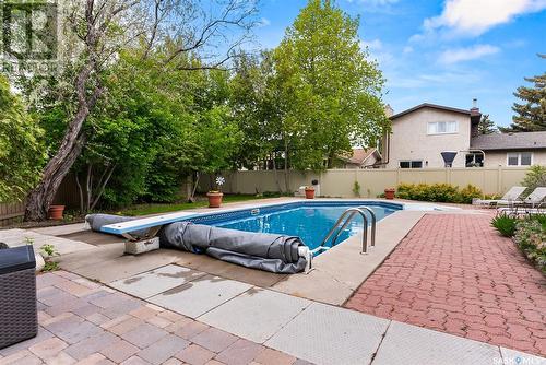 2030 Braun Bay E, Regina, SK - Outdoor With In Ground Pool With Backyard