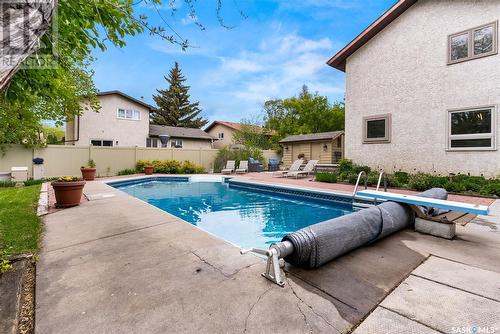 2030 Braun Bay E, Regina, SK - Outdoor With In Ground Pool With Backyard
