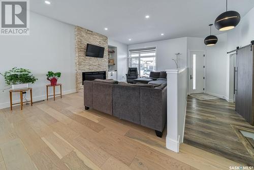 12 Plains Road, Pilot Butte, SK - Indoor Photo Showing Living Room With Fireplace