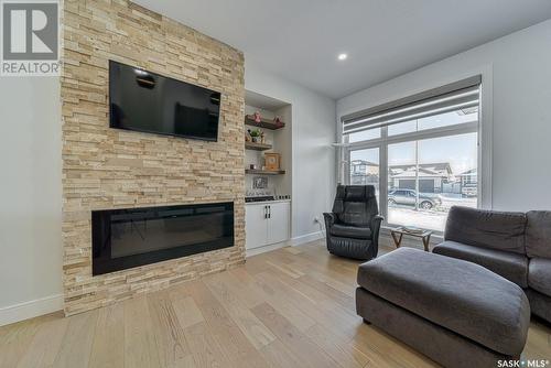 12 Plains Road, Pilot Butte, SK - Indoor Photo Showing Living Room With Fireplace