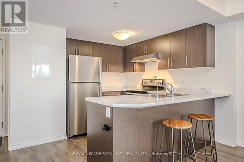 206 - 7 Kay Crescent, Guelph, ON - Indoor Photo Showing Kitchen With Stainless Steel Kitchen With Double Sink