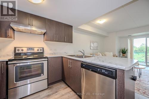 206 - 7 Kay Crescent, Guelph, ON - Indoor Photo Showing Kitchen With Stainless Steel Kitchen With Double Sink
