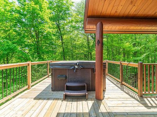 Hot tub - 204 Ch. De La Terrasse-Du-Golf, Mont-Blanc, QC - Outdoor With Deck Patio Veranda With Exterior