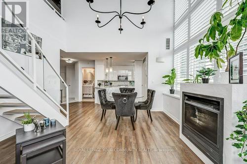 318 - 300 Manitoba Street, Toronto, ON - Indoor Photo Showing Dining Room With Fireplace