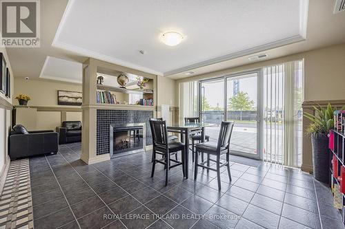 1403 - 1030 Coronation Drive, London, ON - Indoor Photo Showing Dining Room With Fireplace