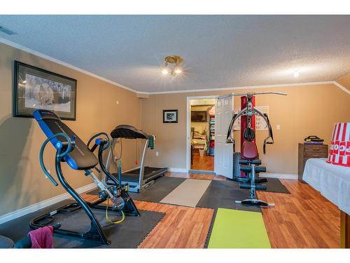 125 Mill Road, Fruitvale, BC - Indoor Photo Showing Gym Room