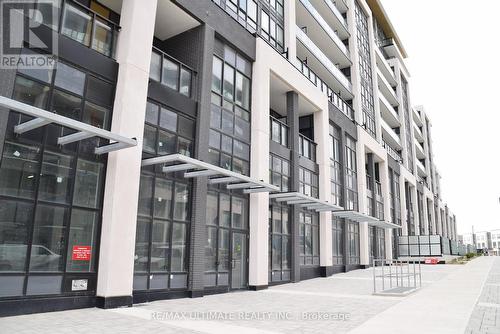 810 - 405 Dundas Street W, Oakville, ON - Outdoor With Facade