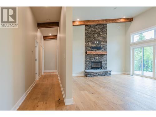 695 Killough  Road, Castlegar, BC - Indoor Photo Showing Other Room With Fireplace