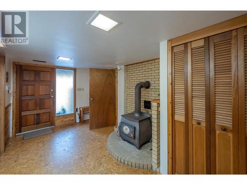 3815 Forsyth Drive, Penticton, BC - Indoor Photo Showing Other Room With Fireplace