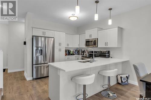 810 Kensington Boulevard, Saskatoon, SK - Indoor Photo Showing Kitchen With Stainless Steel Kitchen With Double Sink With Upgraded Kitchen