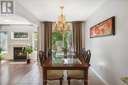 12 - 601 Grenfell Drive, London, ON - Indoor Photo Showing Dining Room With Fireplace