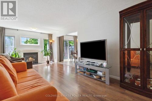 12 - 601 Grenfell Drive, London, ON - Indoor Photo Showing Living Room With Fireplace