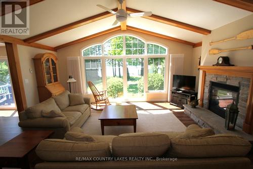 275 Mcguire Beach Road, Kawartha Lakes, ON - Indoor Photo Showing Living Room With Fireplace