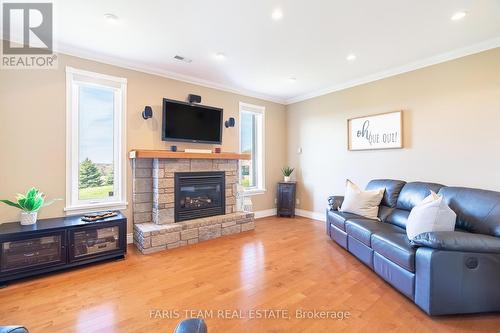 130 Concession 15 W, Tiny, ON - Indoor Photo Showing Living Room With Fireplace