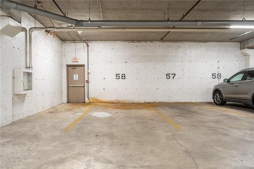 large parking space #58 - 396 Plains Road E|Unit #508, Burlington, ON - Indoor Photo Showing Garage