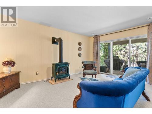 4189 Gallaghers Crescent, Kelowna, BC - Indoor Photo Showing Living Room With Fireplace