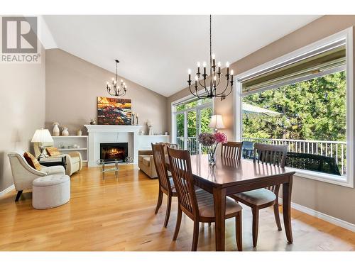 4189 Gallaghers Crescent, Kelowna, BC - Indoor Photo Showing Dining Room With Fireplace