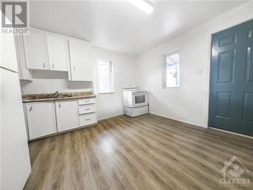 Virtually staged - 43 Government Road E, Kirkland Lake, ON - Indoor Photo Showing Kitchen With Double Sink