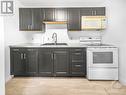 Virtually staged - 43 Government Road E, Kirkland Lake, ON  - Indoor Photo Showing Kitchen With Double Sink 