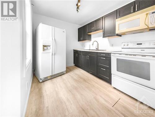 Virtually staged - 43 Government Road E, Kirkland Lake, ON - Indoor Photo Showing Kitchen