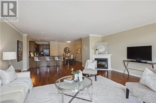 408 - 1998 Ironstone Drive, Burlington, ON - Indoor Photo Showing Living Room With Fireplace