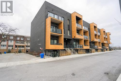 226 - 1145 Journeyman Lane, Mississauga, ON - Outdoor With Balcony With Facade