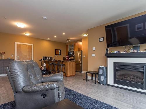 302-2745 Veterans Memorial Pkwy, Langford, BC - Indoor Photo Showing Living Room With Fireplace