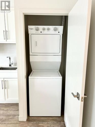 1407 - 2087 Fairview Street, Burlington, ON - Indoor Photo Showing Laundry Room