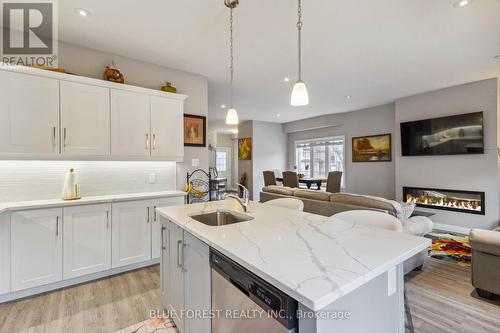 63 - 2040 Shore Road, London, ON - Indoor Photo Showing Kitchen With Fireplace With Upgraded Kitchen