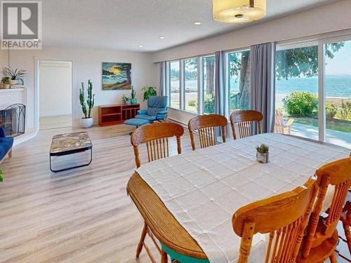 6877 Klahanie Drive, Powell River, BC - Indoor Photo Showing Dining Room With Fireplace