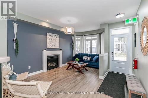 7 - 218 Crosswinds Boulevard, Blue Mountains, ON - Indoor Photo Showing Living Room With Fireplace