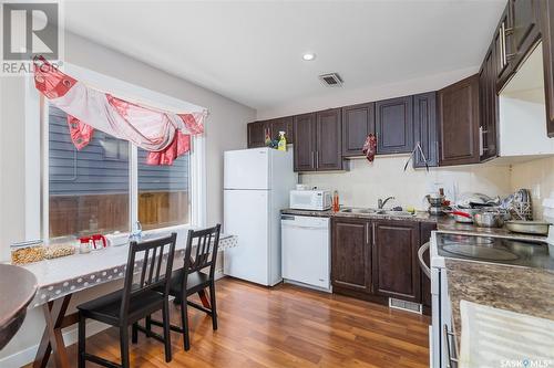 103 T Avenue N, Saskatoon, SK - Indoor Photo Showing Kitchen With Double Sink