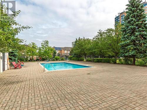 309 - 330 Alton Towers Circle, Toronto, ON - Outdoor With In Ground Pool With Backyard