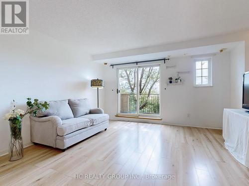 728 - 1881 Mcnicoll Avenue, Toronto E05, ON - Indoor Photo Showing Living Room