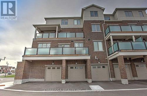 601 - 1148 Dragonfly Avenue, Pickering, ON - Outdoor With Balcony With Facade