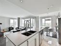 Vue d'ensemble - 407-1130 Boul. Mattawa, Laval (Fabreville), QC  - Indoor Photo Showing Kitchen With Double Sink 